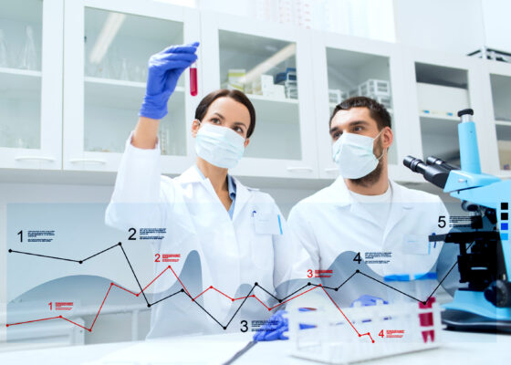 Scientists With Test Tubes Making Research At Lab